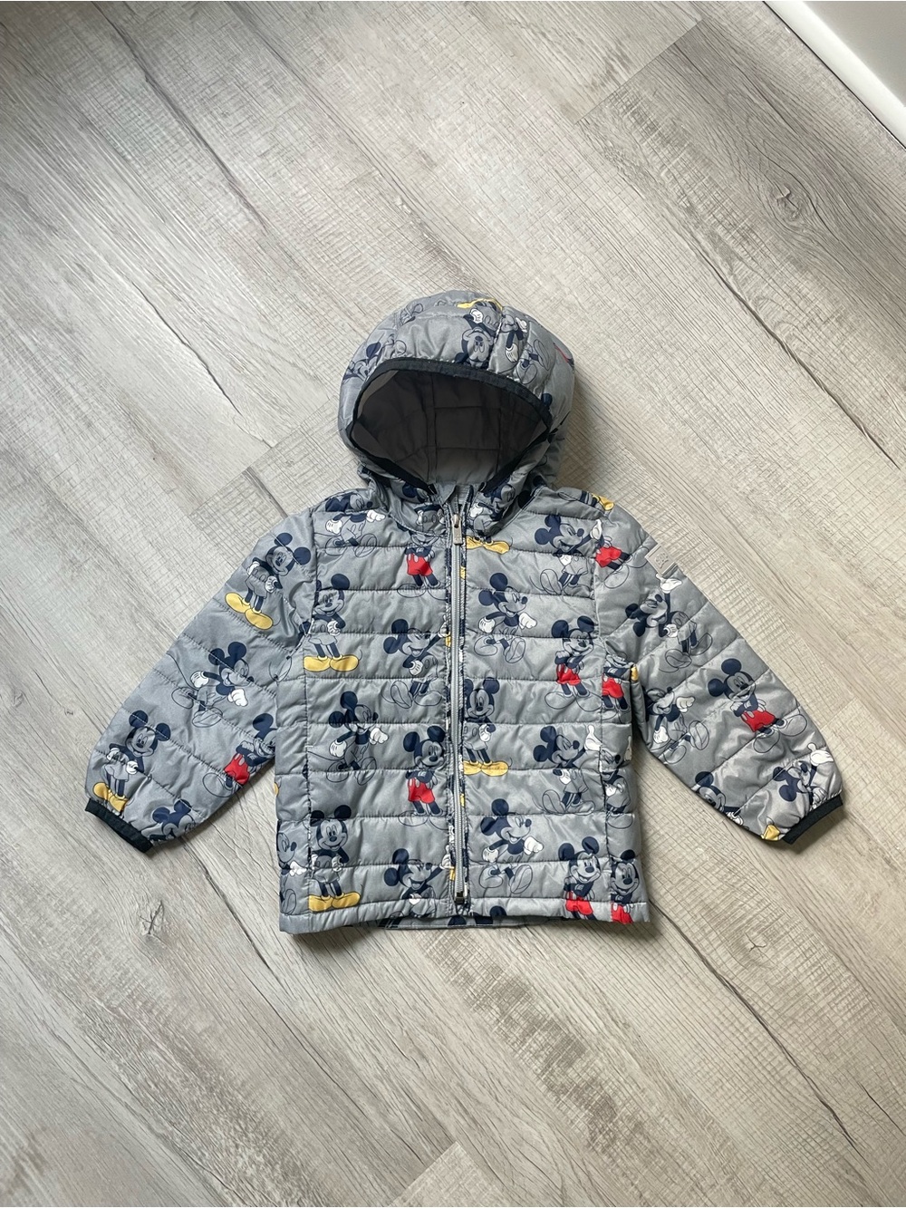 GAP x Disney Gray Mickey Mouse Hooded Puffer Jacket with Navy and Yellow Accents